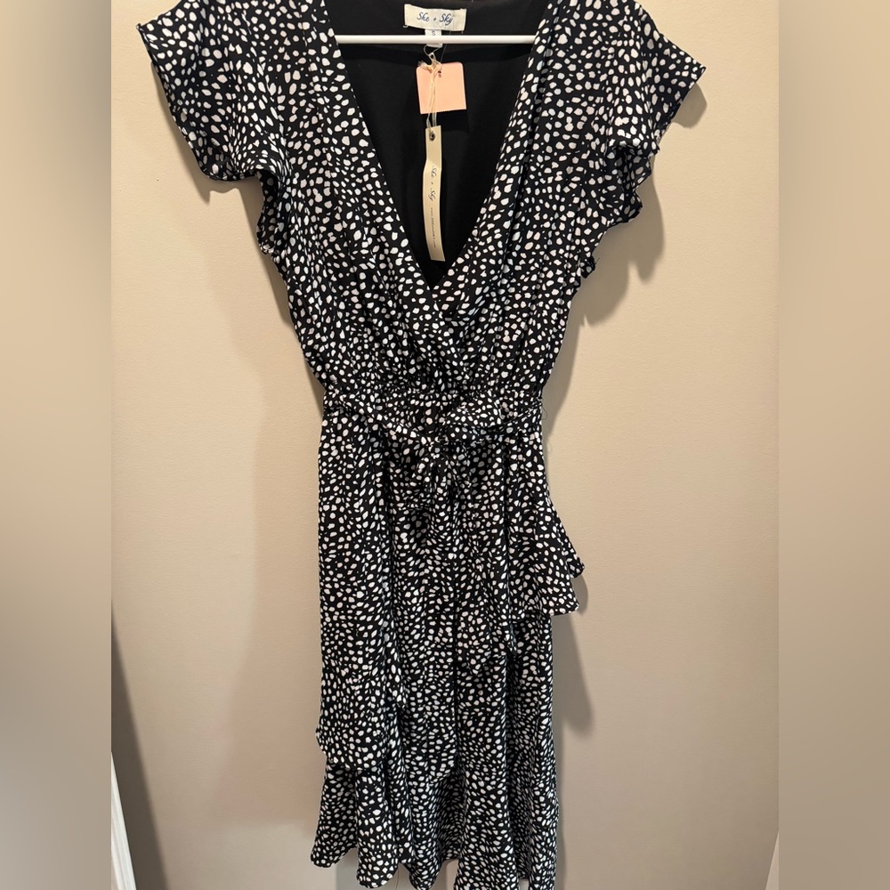 Unworn black and white she and shy dress. Tags on.